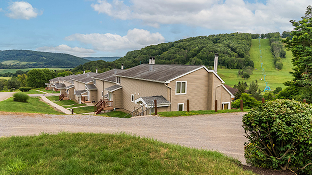 A summertime view of the Fox Ridge condo units, overlooking the slopes of Holiday Valley. 